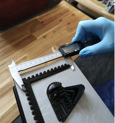 Using calipers to measure validation test print